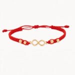 Pulsera De Oro 18K Con Esferas  Hilo Rojo Y Herraje Infinito