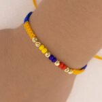 Pulsera Oro 18K Con Esferas Diamantadas Tejida Con Hilo Tricolor - Imagen 3