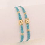 Pulsera De Oro Con Cilindros 5X7 Y Esferas Diamantadas Hilo Celeste - Imagen 2
